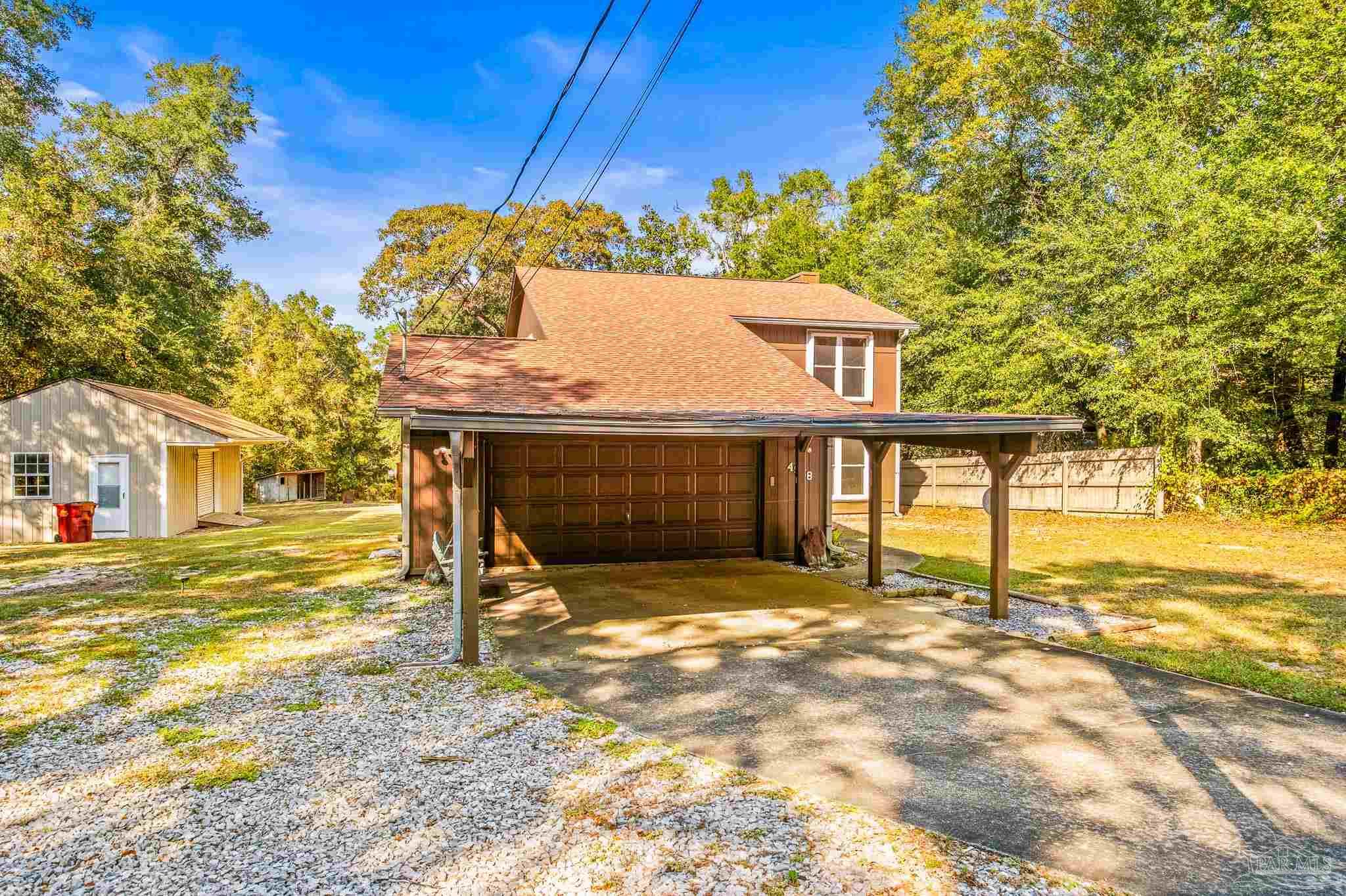 4928 Shell Road Milton, FL 32583 - Photo 5 of 60 a view of a house with a yard