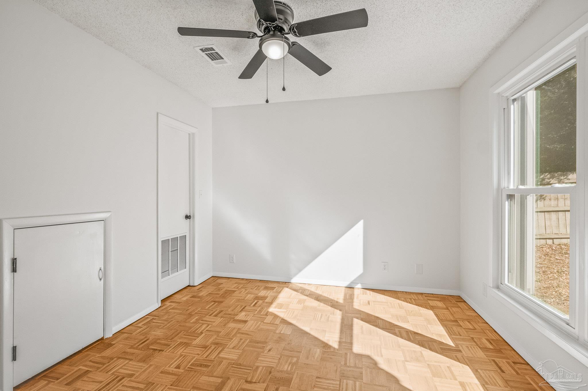 4928 Shell Road Milton, FL 32583 - Photo 7 of 60 a view of a room with a window and a ceiling fan