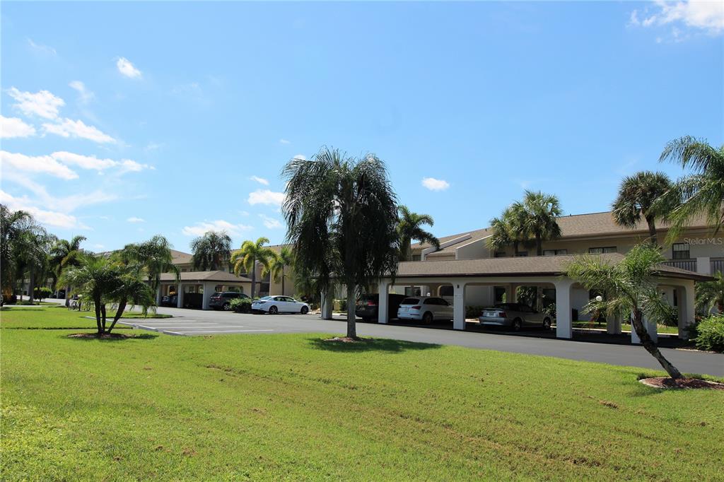 265 Coldeway Drive, Unit D6 Punta Gorda, FL 33950 - Photo 1 of 1 a view of a house with a yard