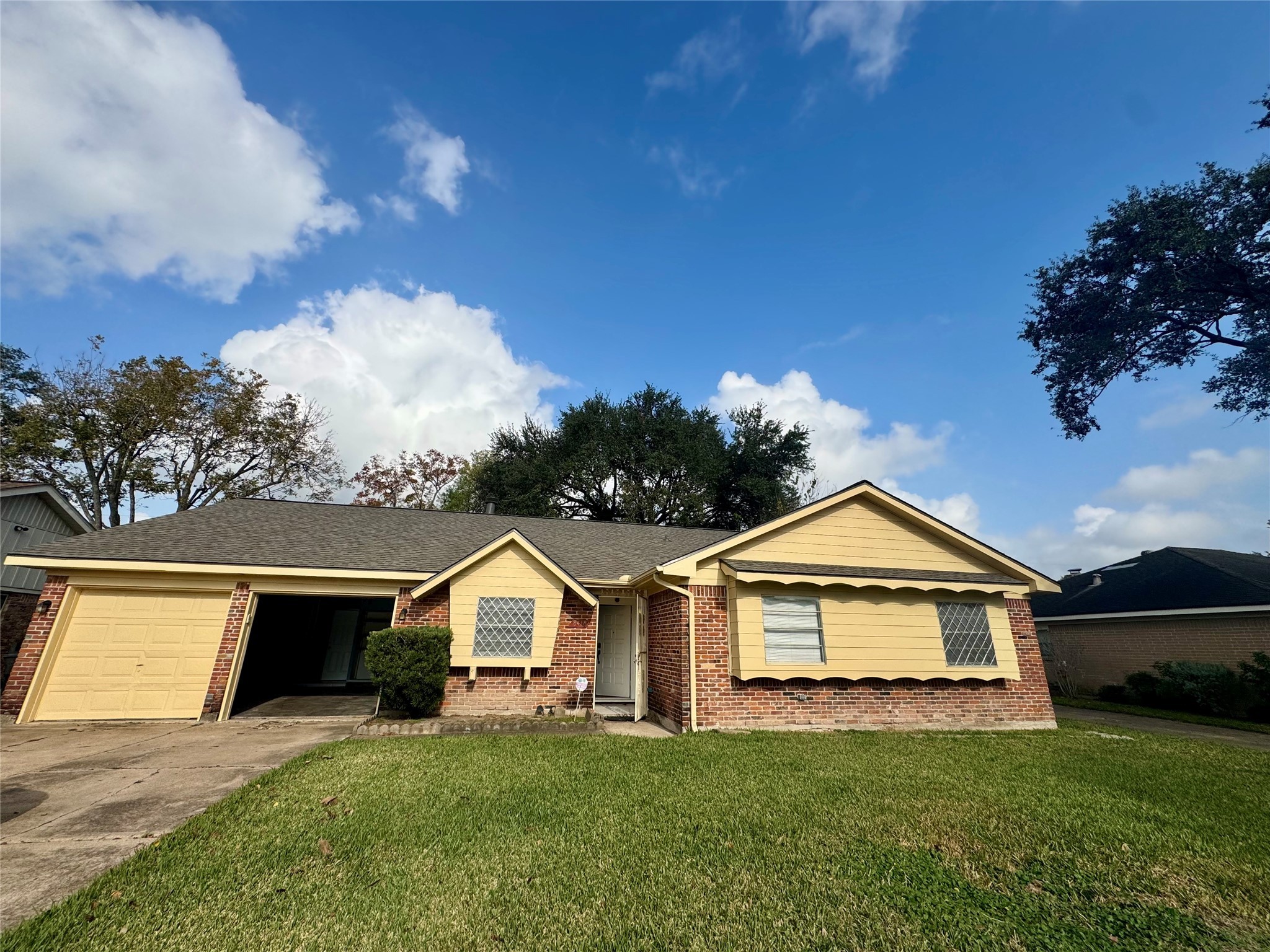 8418 Hazen Street Houston, TX 77036 - Photo 1 of 25 a front view of a house with yard
