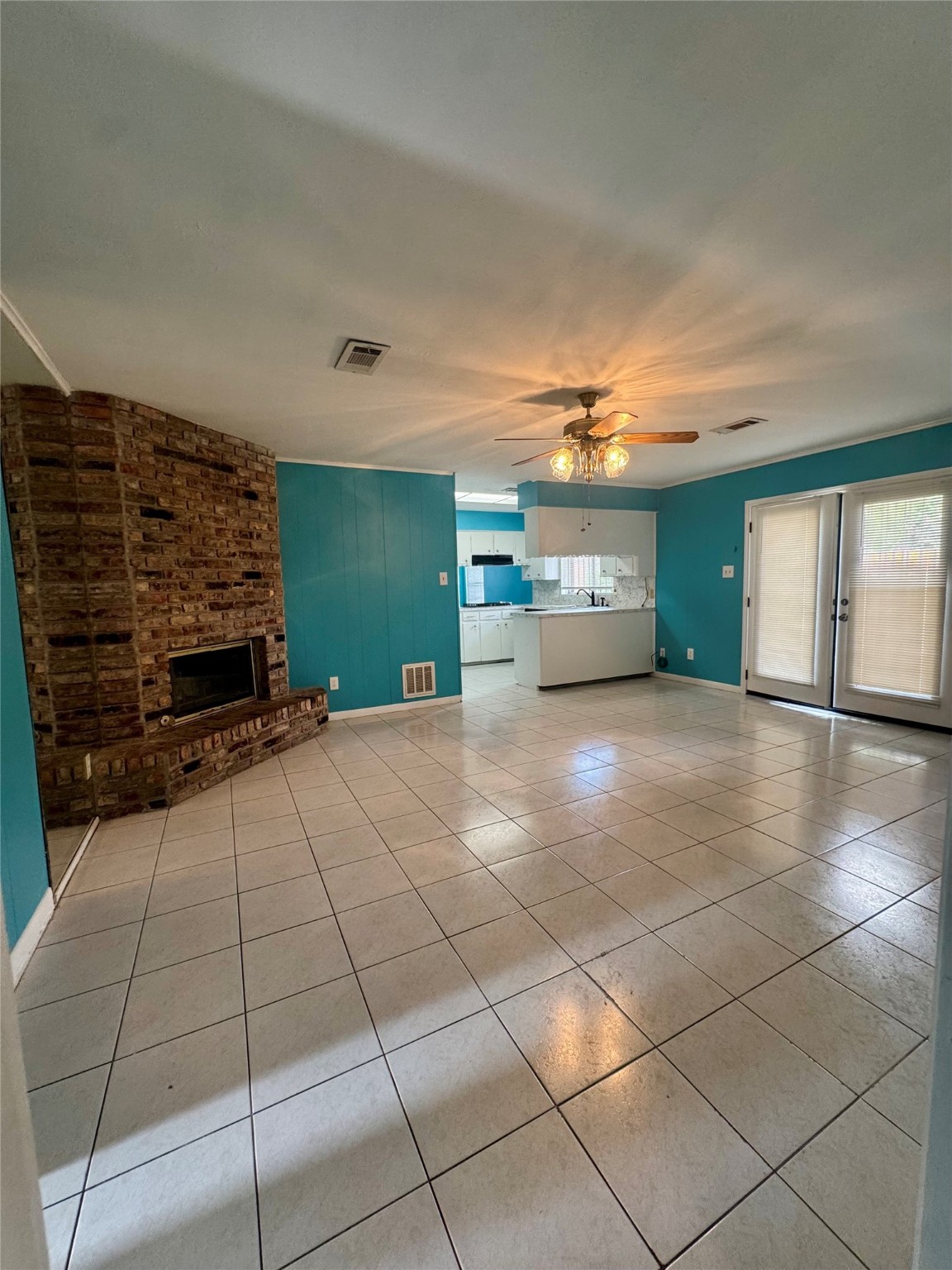 8418 Hazen Street Houston, TX 77036 - Photo 3 of 25 a view of an empty room with a fireplace