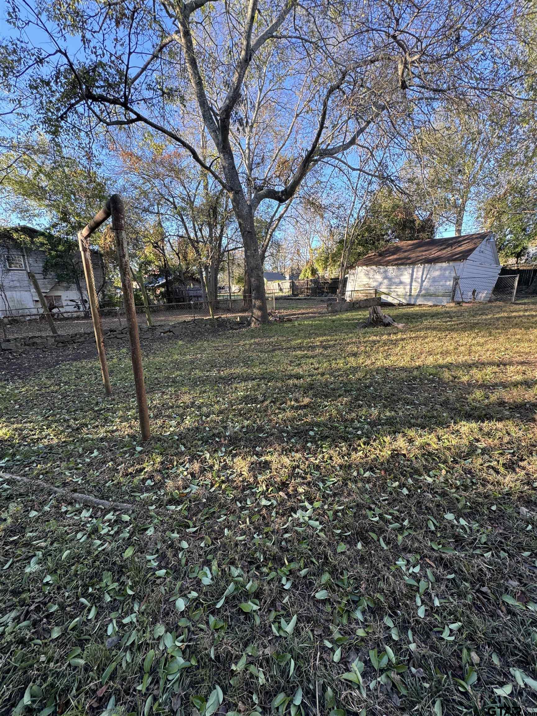 1014 Mockingbird Lane Tyler, TX 75701 - Photo 3 of 6 a view of a yard with a tree