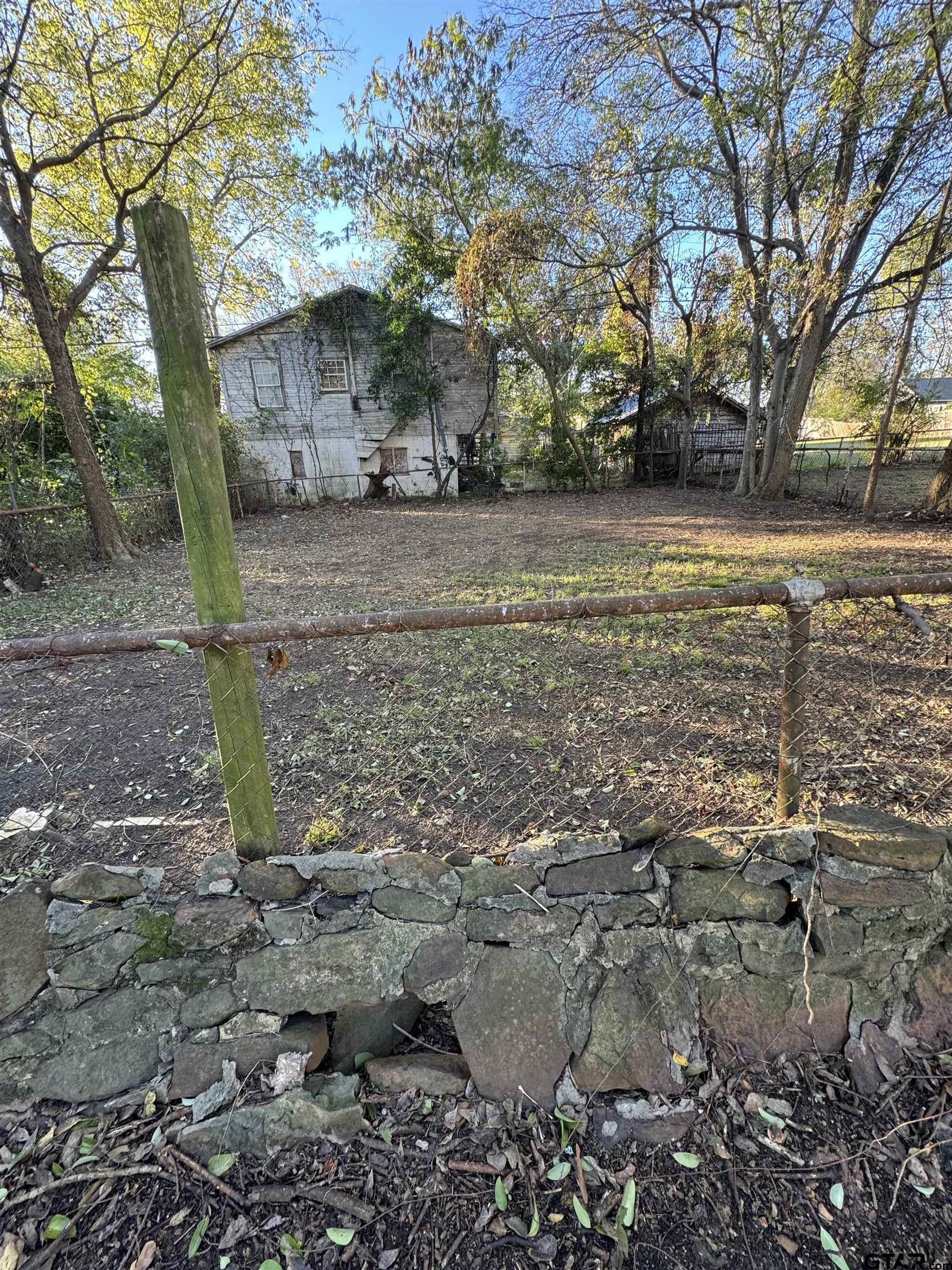 1014 Mockingbird Lane Tyler, TX 75701 - Photo 4 of 6 a view of a yard with a tree