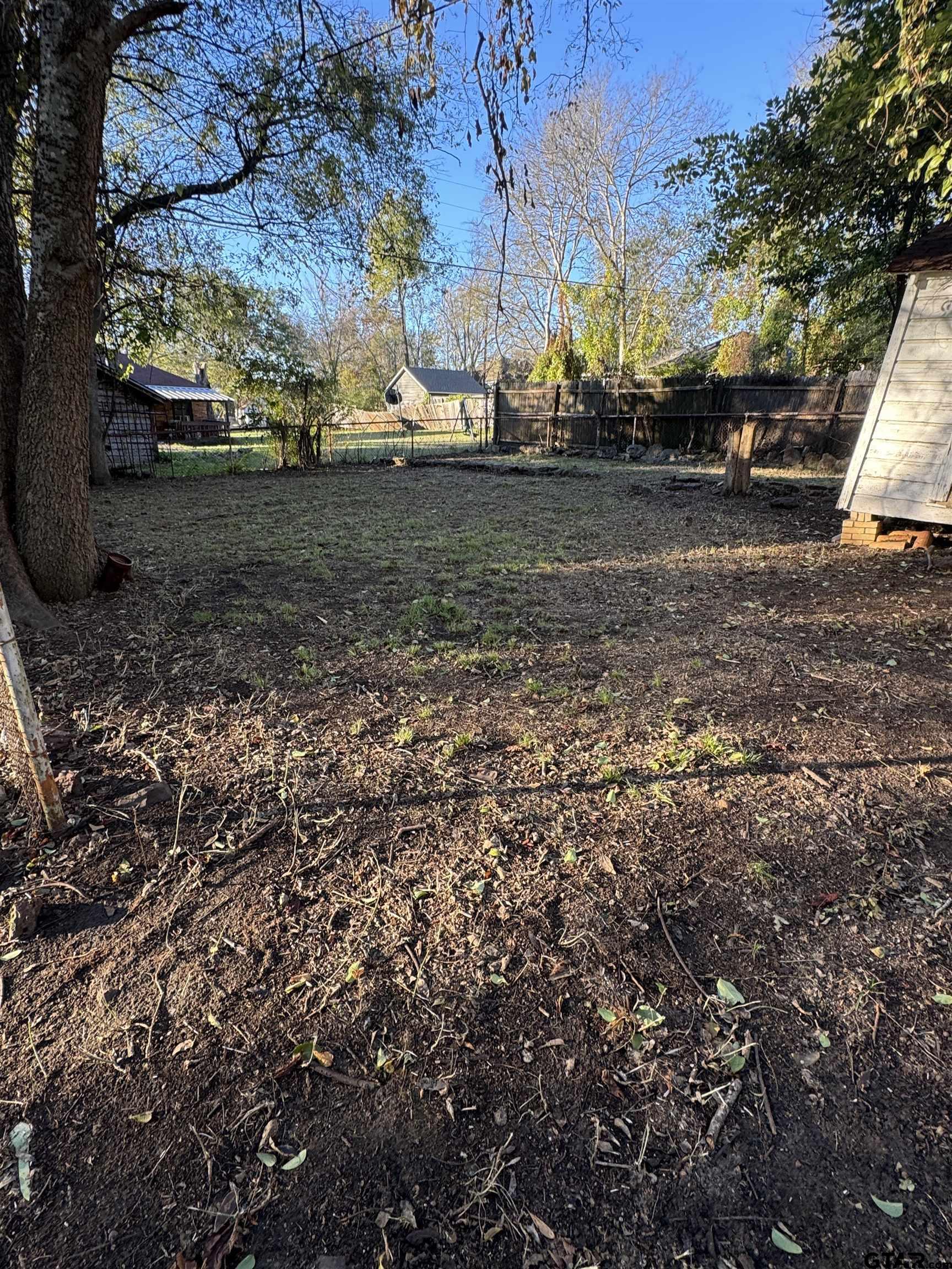 1014 Mockingbird Lane Tyler, TX 75701 - Photo 5 of 6 a view of a yard with large trees
