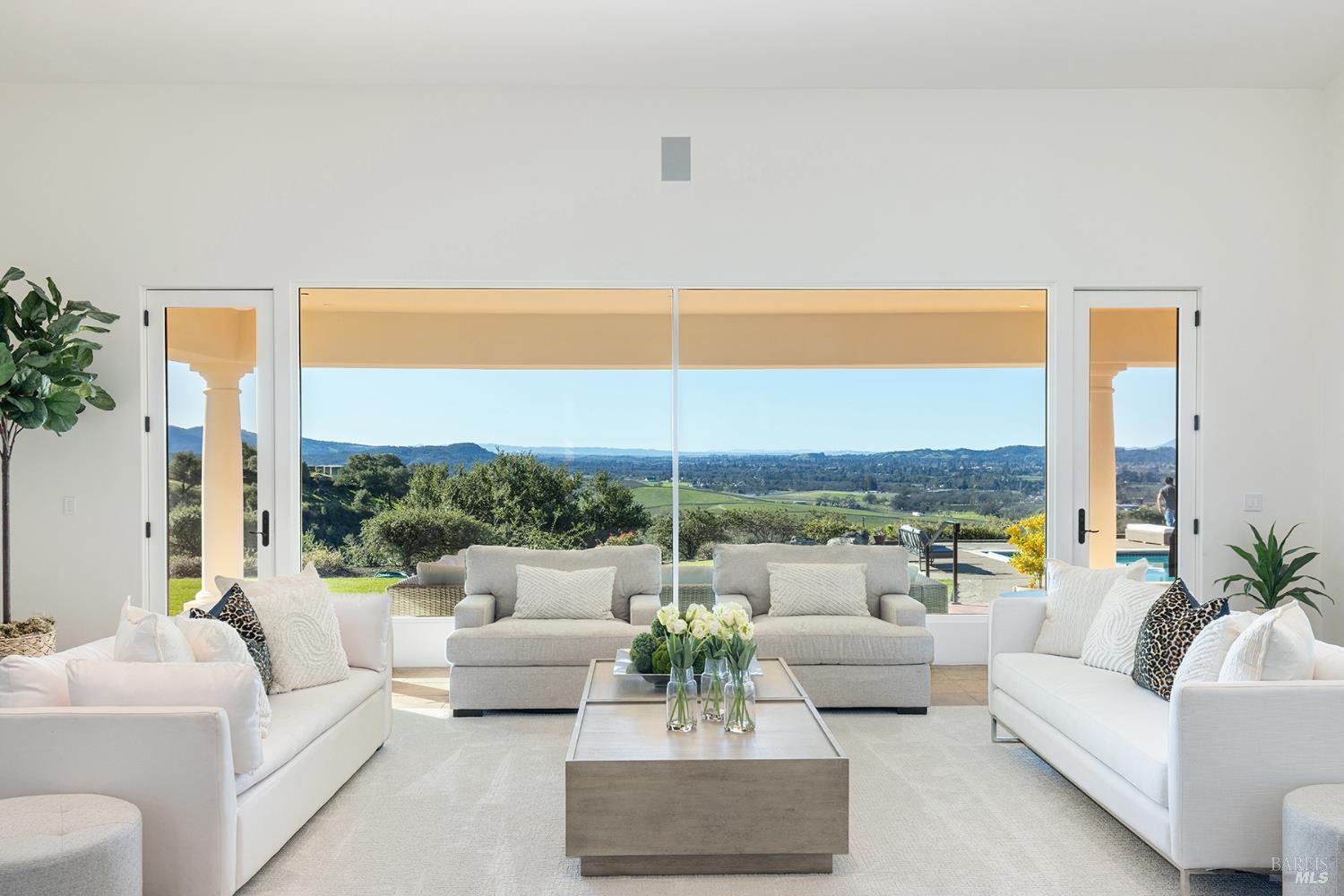 2300 Old Soda Springs Road Napa, CA 94558 - Photo 3 of 60 Stunning Napa Valley Panoramic views! The single story main residence offers 5,181 sq.ft w/4 Bed-5.5 Baths, and an office, featuring expansive covered terraces framing the glorious Napa Valley vineyard and western hills views.