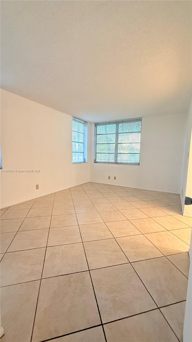 1811 Sabal Palm Drive, Unit 208 Davie, FL 33324 - Photo 11 of 32 a view of an empty room with a window