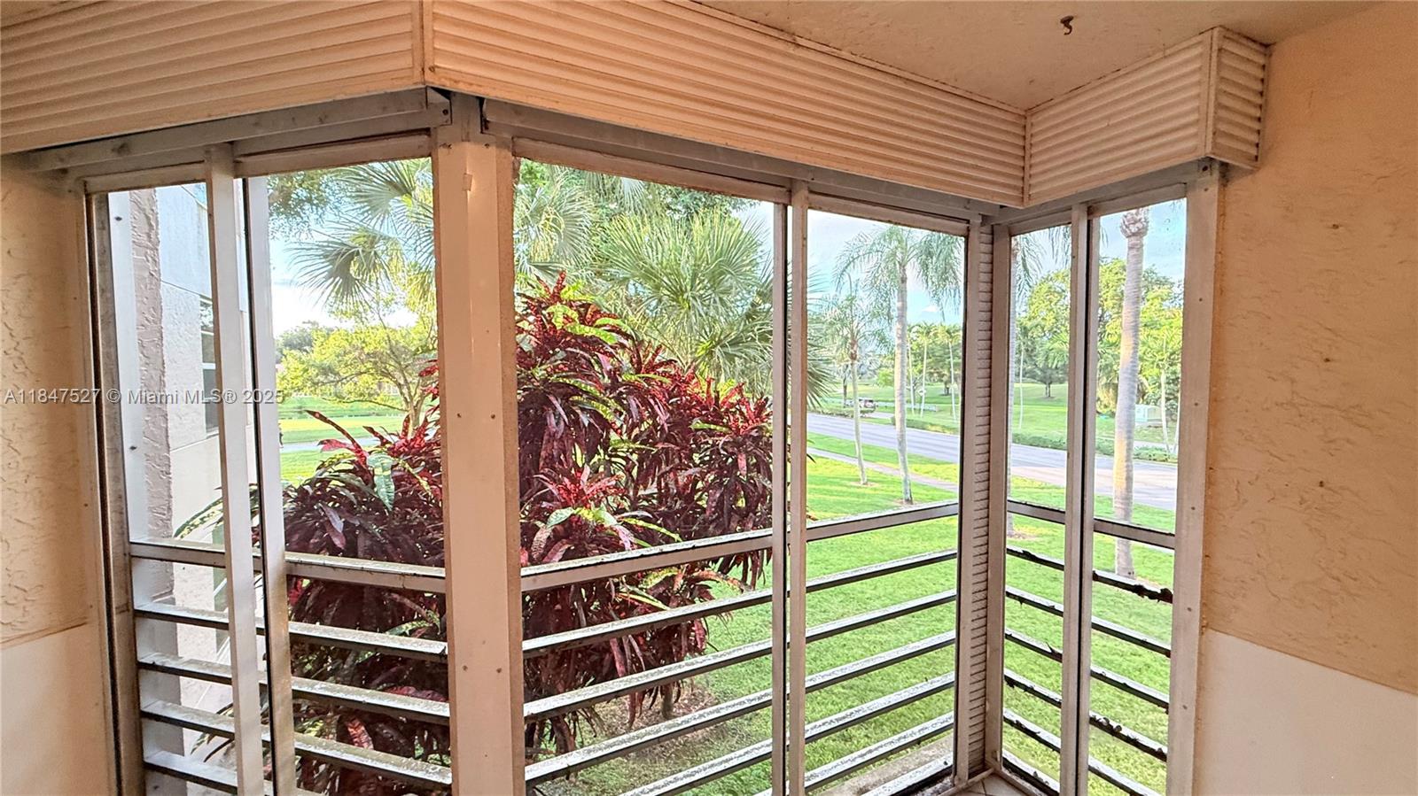 1811 Sabal Palm Drive, Unit 208 Davie, FL 33324 - Photo 14 of 32 a view of a room with windows and walls