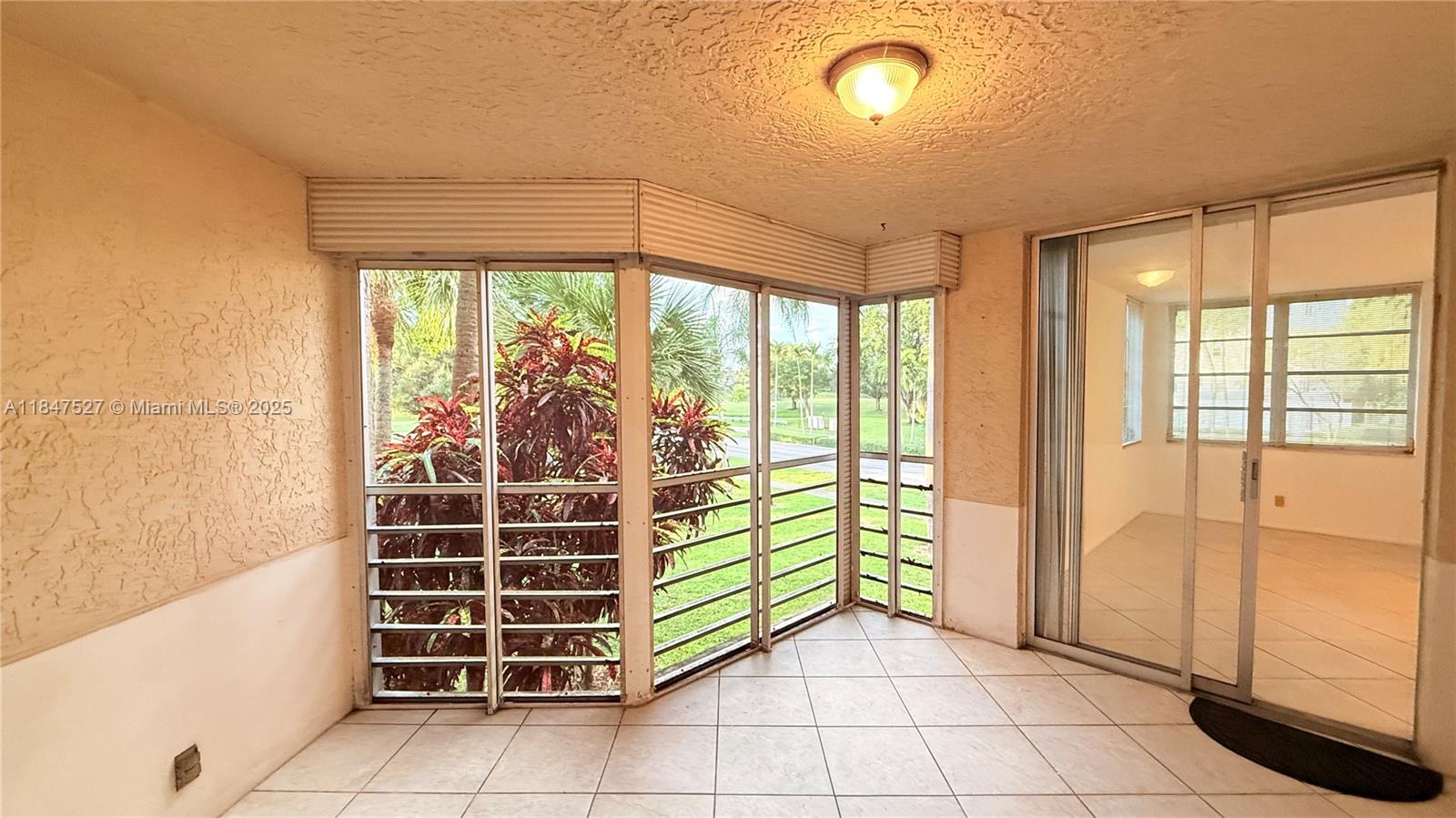 1811 Sabal Palm Drive, Unit 208 Davie, FL 33324 - Photo 16 of 32 a view of a room with windows