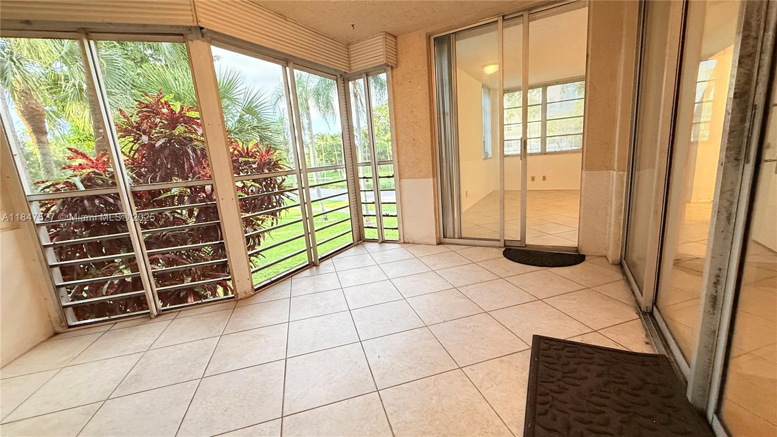 1811 Sabal Palm Drive, Unit 208 Davie, FL 33324 - Photo 17 of 32 a view of an empty room with a window