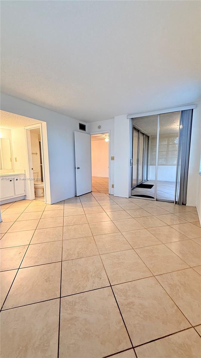 1811 Sabal Palm Drive, Unit 208 Davie, FL 33324 - Photo 24 of 32 a view of an empty room with a window