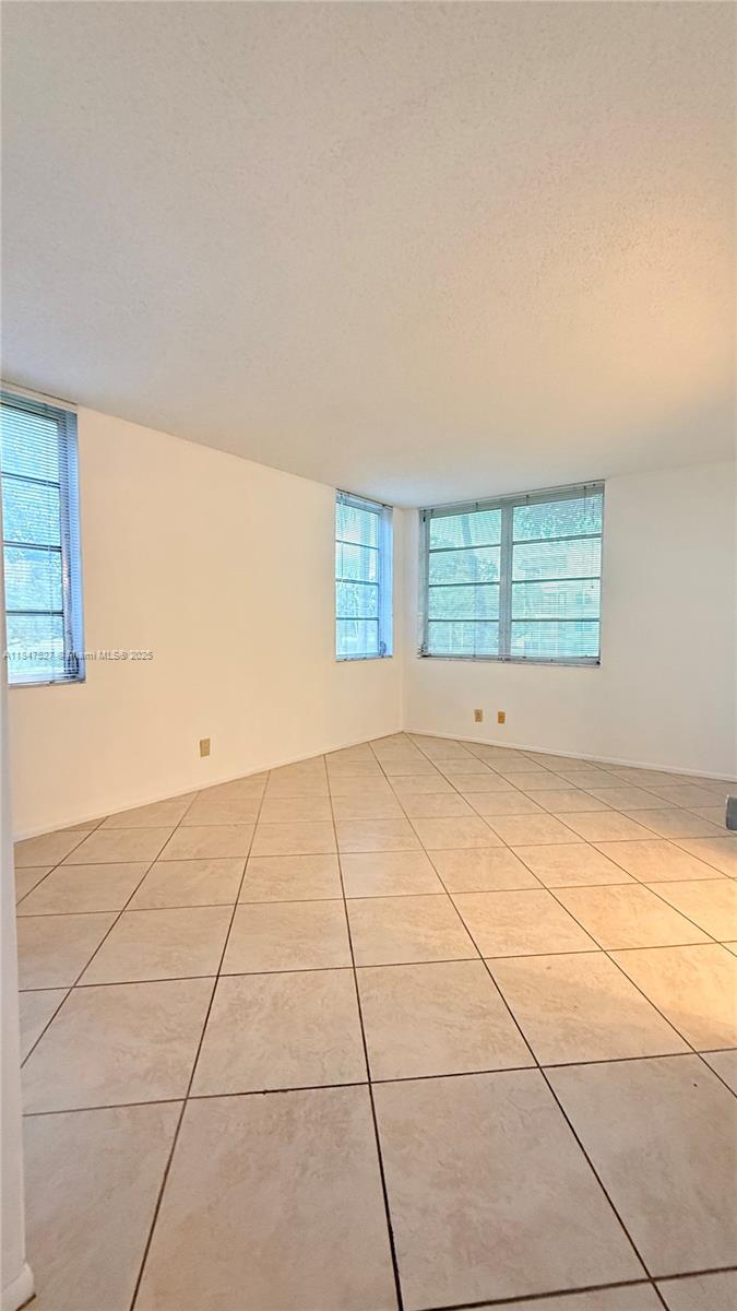 1811 Sabal Palm Drive, Unit 208 Davie, FL 33324 - Photo 26 of 32 a view of an empty room with a window