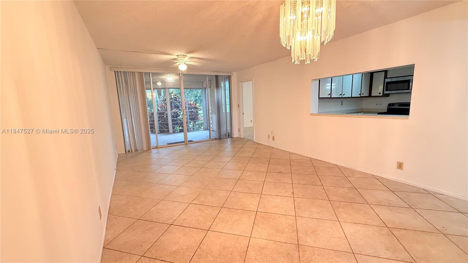 1811 Sabal Palm Drive, Unit 208 Davie, FL 33324 - Photo 27 of 32 a view of an empty room and window