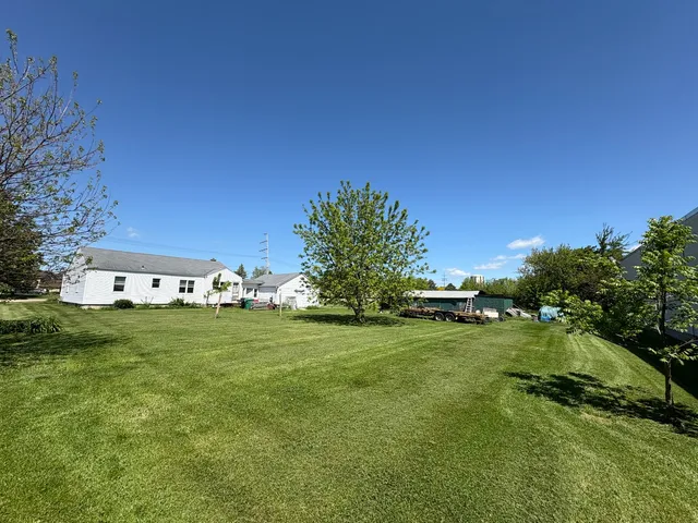 a view of a big yard with a house