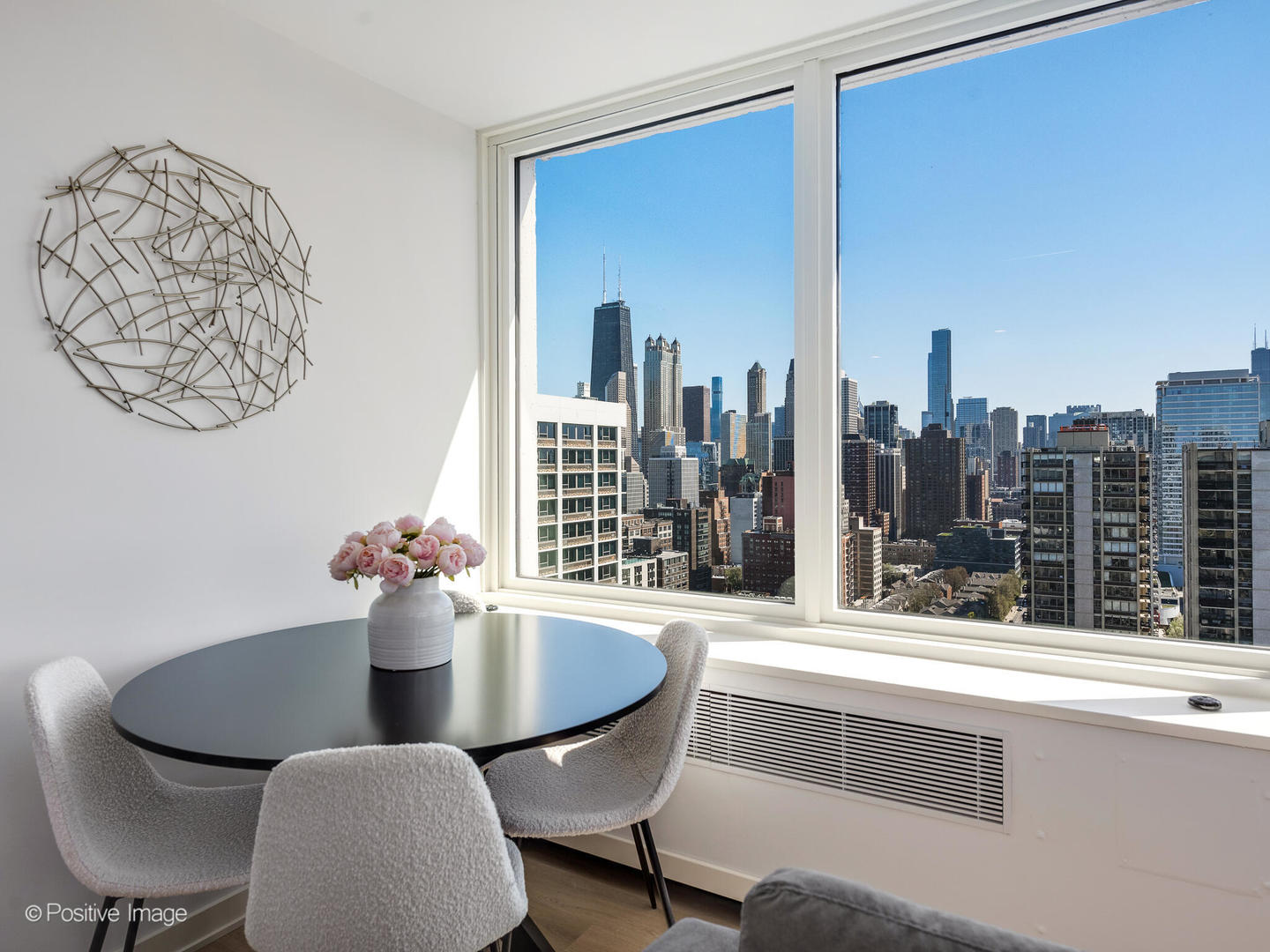 1455 North Sandburg Terrace, Unit 2901B Chicago, IL 60610 - Photo 12 of 42 a view of a dining room with furniture and window
