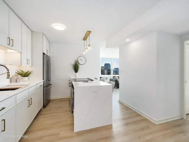 a kitchen with a sink and a stove top oven