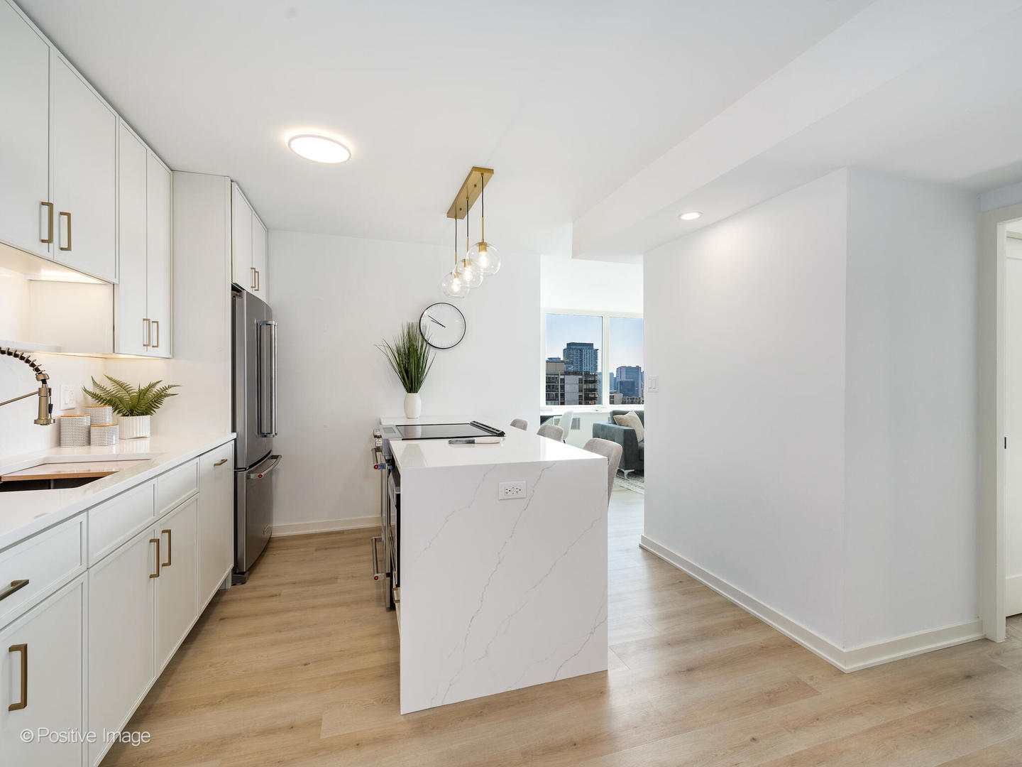 1455 North Sandburg Terrace, Unit 2901B Chicago, IL 60610 - Photo 14 of 42 a kitchen with a sink and a stove top oven
