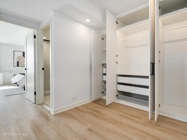 a view of a bathroom with a shower and a tub