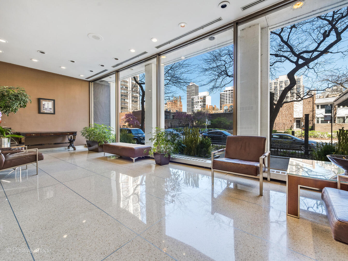 1455 North Sandburg Terrace, Unit 2901B Chicago, IL 60610 - Photo 2 of 42 a lobby with furniture and floor to ceiling window