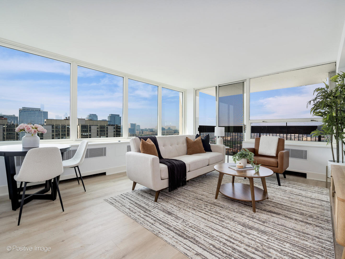 1455 North Sandburg Terrace, Unit 2901B Chicago, IL 60610 - Photo 5 of 42 a living room with furniture and a large window
