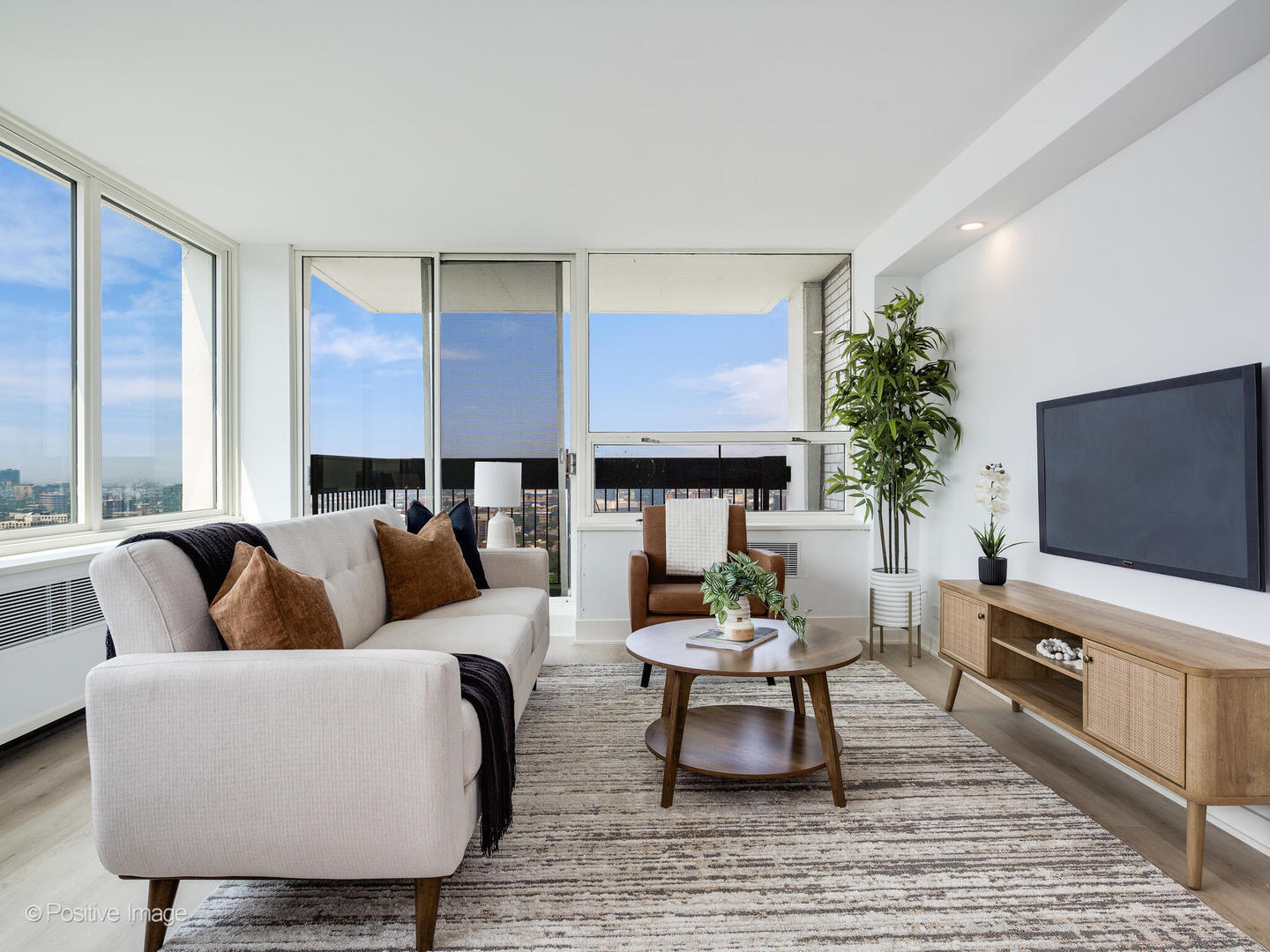1455 North Sandburg Terrace, Unit 2901B Chicago, IL 60610 - Photo 6 of 42 a living room with furniture and a flat screen tv