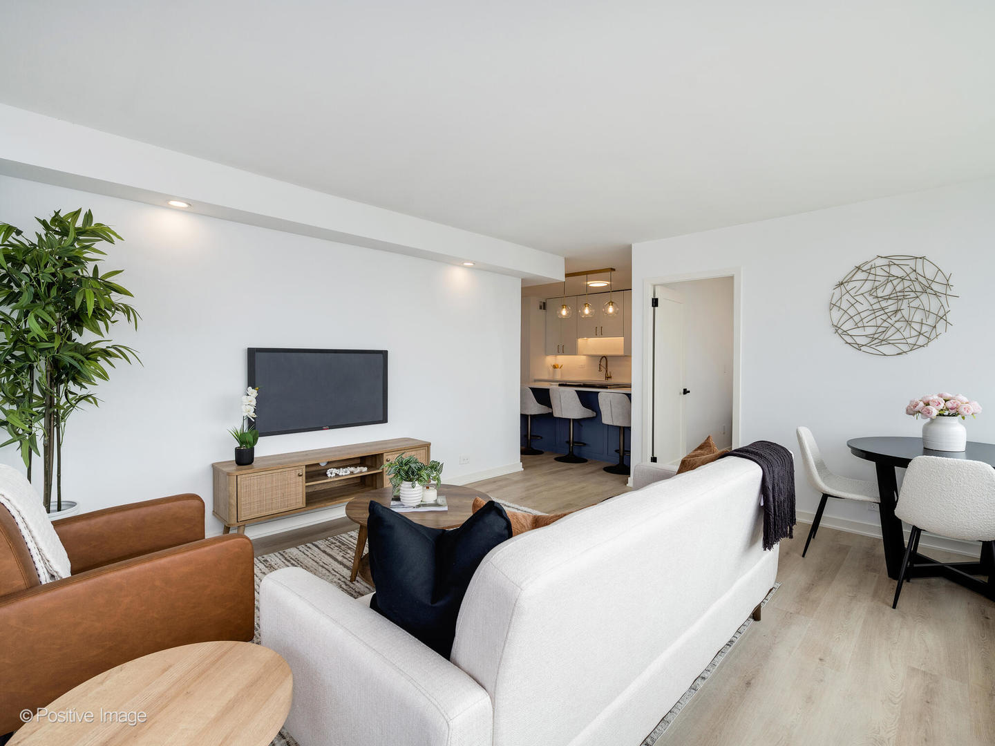 1455 North Sandburg Terrace, Unit 2901B Chicago, IL 60610 - Photo 7 of 42 a living room with furniture and a flat screen tv