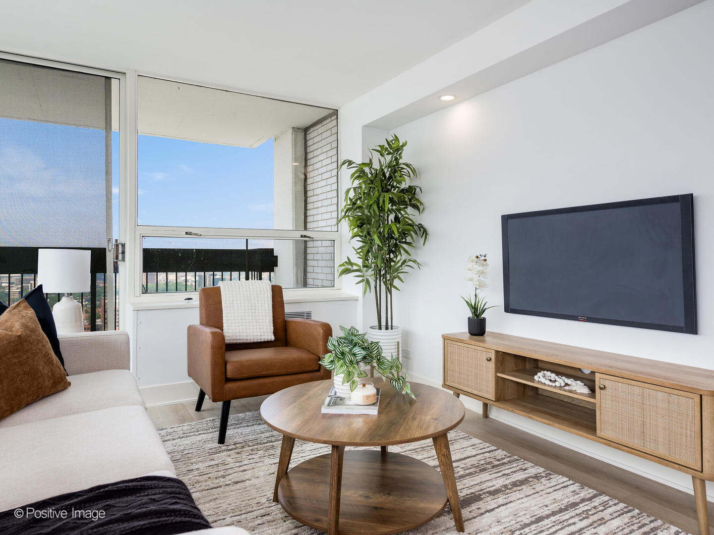 1455 North Sandburg Terrace, Unit 2901B Chicago, IL 60610 - Photo 9 of 42 a living room with furniture and a flat screen tv