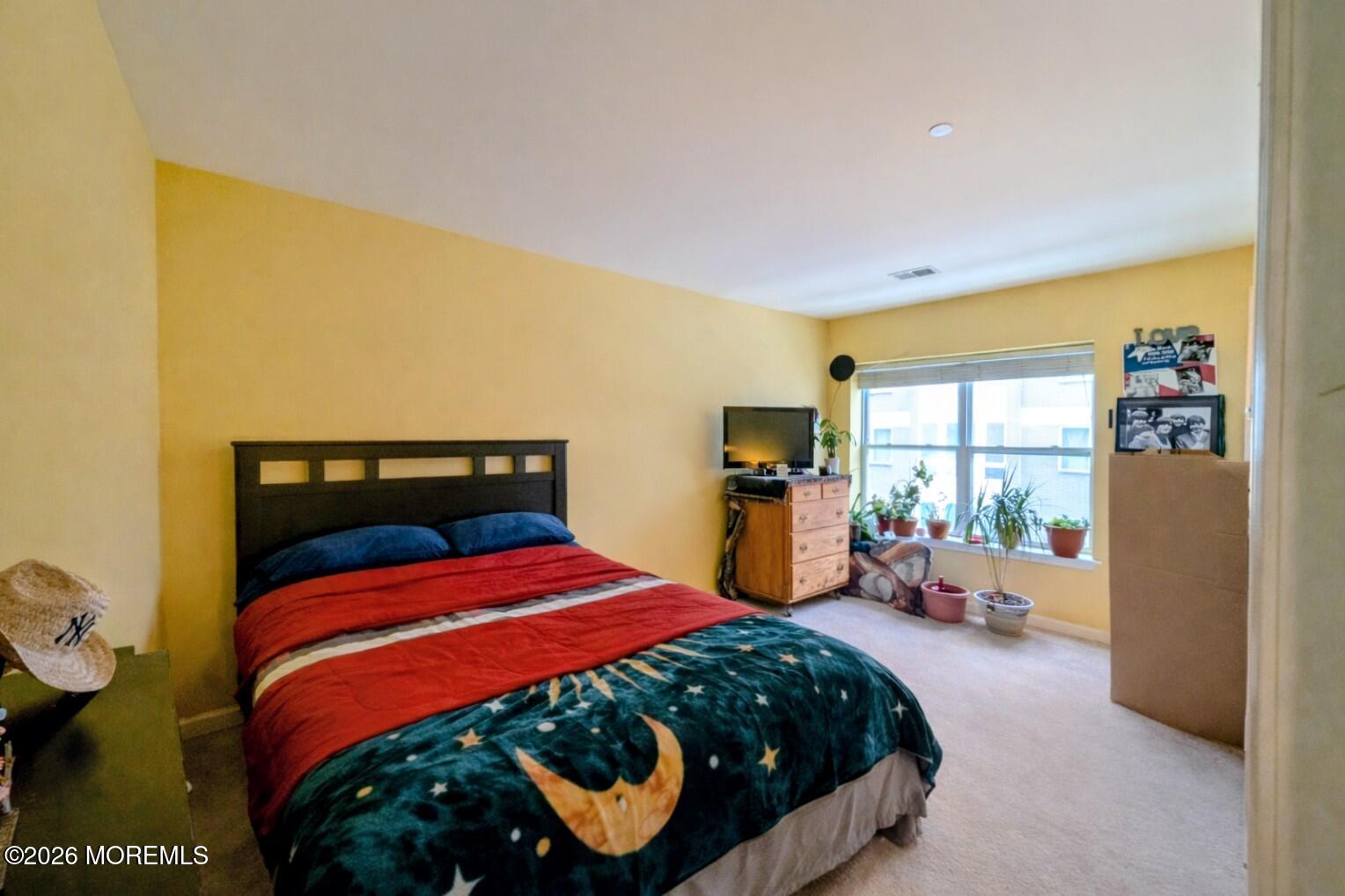 368 Rector Street, Unit 419 Perth Amboy, NJ 08861 - Photo 6 of 14 a bedroom with a bed and large windows