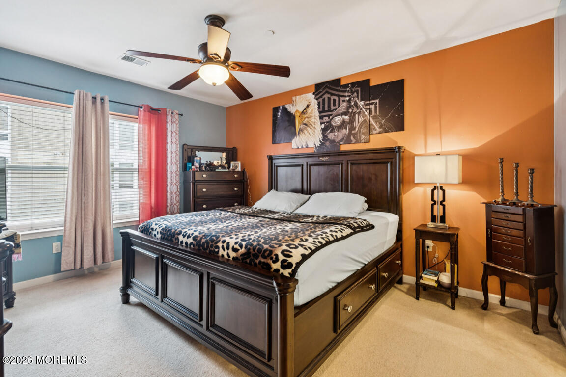 368 Rector Street, Unit 419 Perth Amboy, NJ 08861 - Photo 8 of 14 a bedroom with a bed and a chandelier