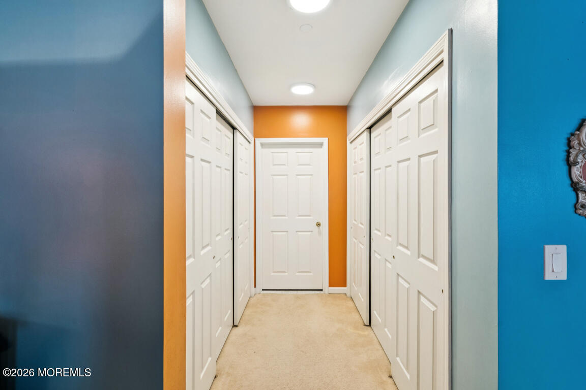 368 Rector Street, Unit 419 Perth Amboy, NJ 08861 - Photo 9 of 14 a view of a hallway with wooden floor and windows