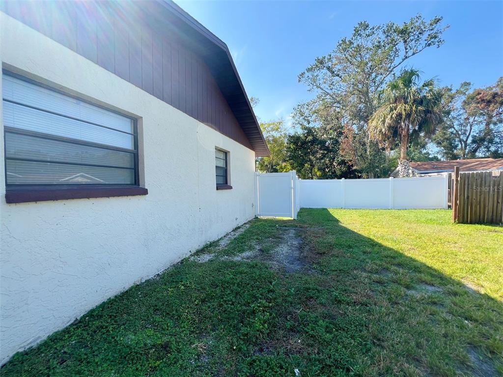 1016 9th Avenue Northwest, Unit B Largo, FL 33770 - Photo 11 of 11 a view of a backyard with a garden