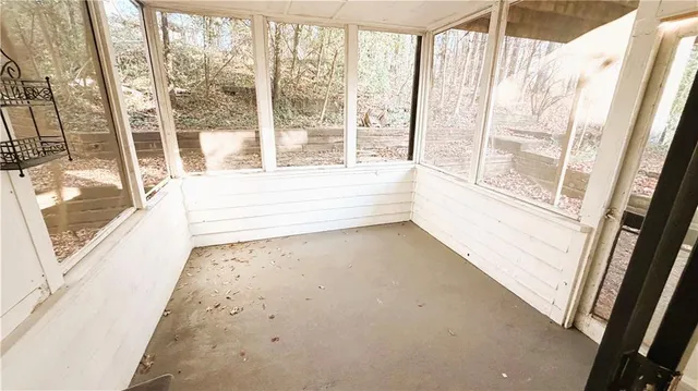 a view of entry way with wooden floor and door