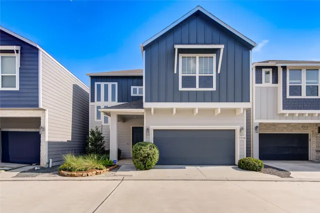 a front view of a house with yard