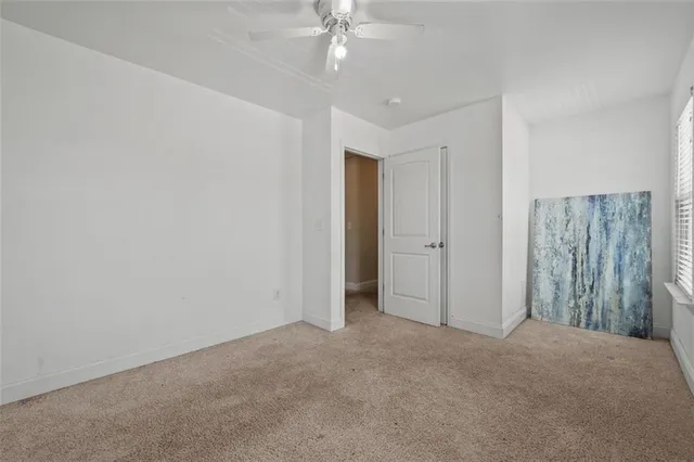 a bed room with a bed and dresser