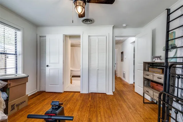 a view of a bedroom with furniture and staircase