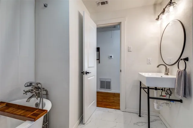 a view of a room with a table and chairs