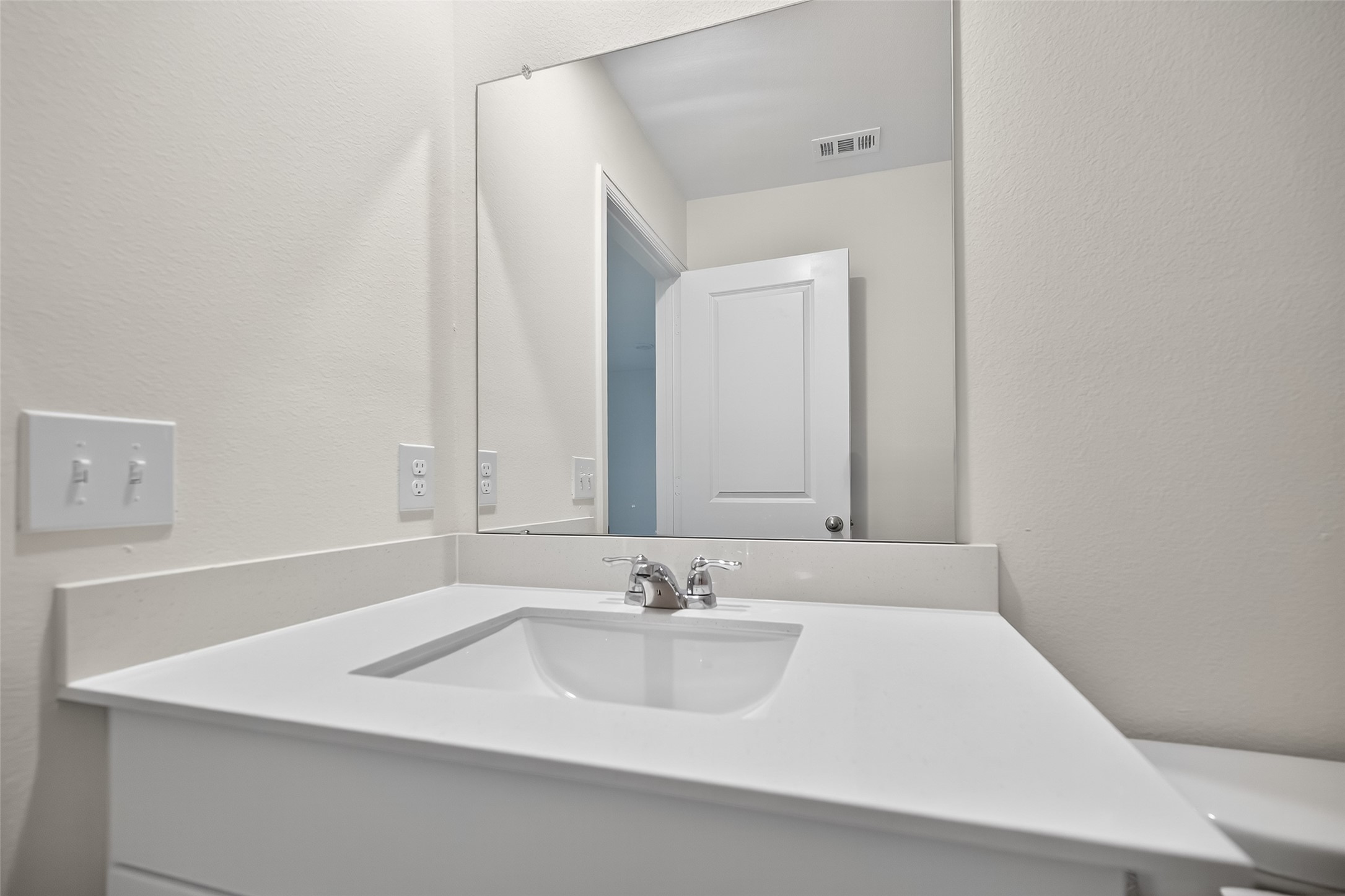 18752 Lucas Michael Way New Caney, TX 77357 - Photo 11 of 19 a bathroom with a sink and a mirror