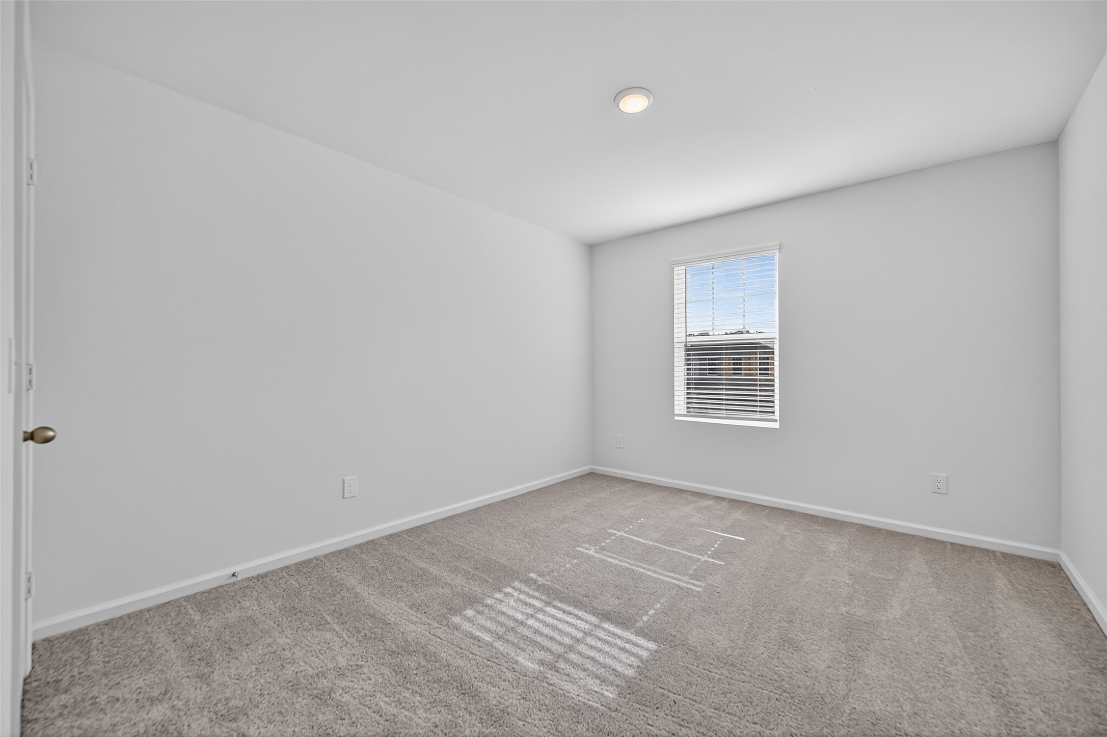 18752 Lucas Michael Way New Caney, TX 77357 - Photo 12 of 19 an empty room with a window