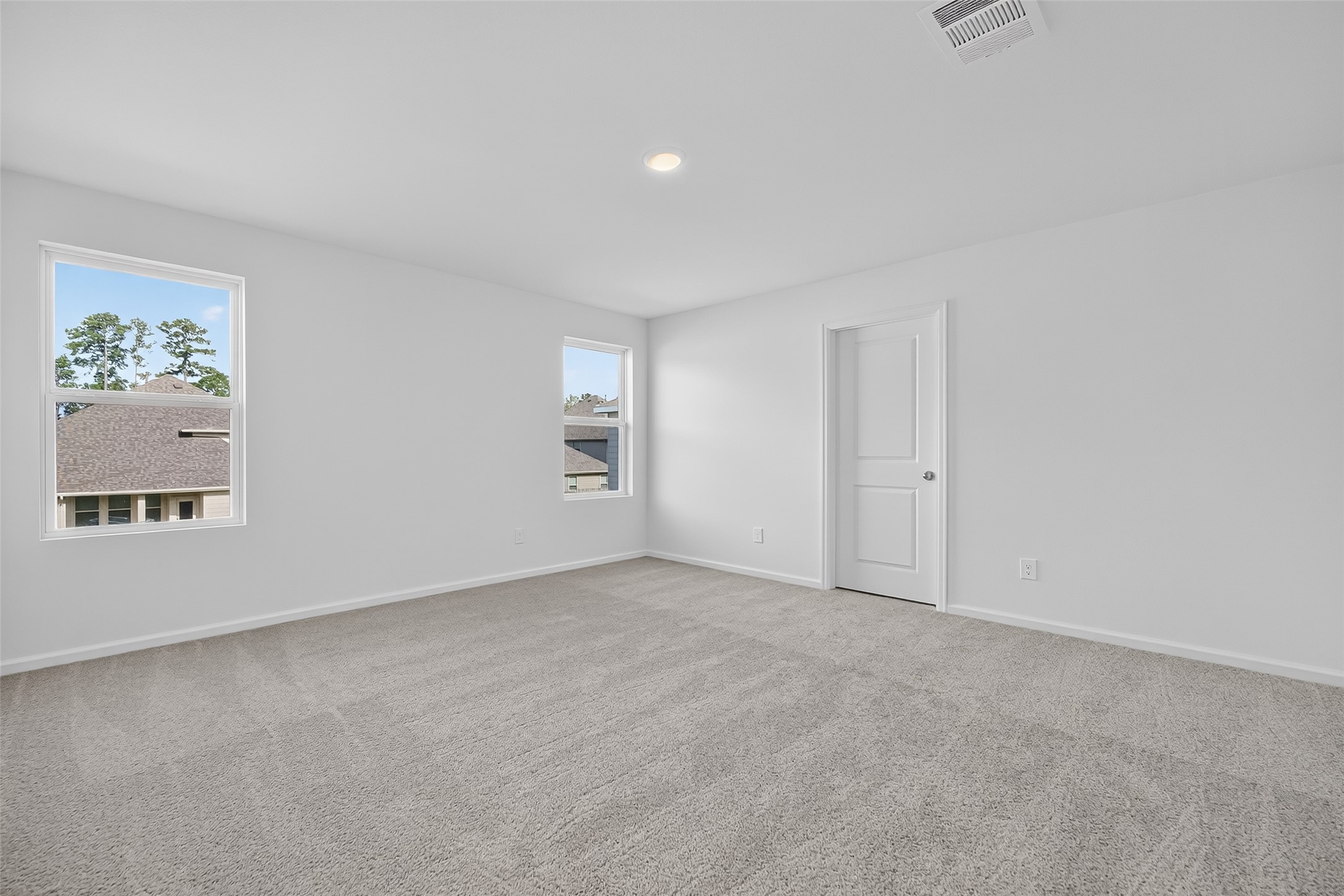 18752 Lucas Michael Way New Caney, TX 77357 - Photo 14 of 19 an empty room with a empty space and windows