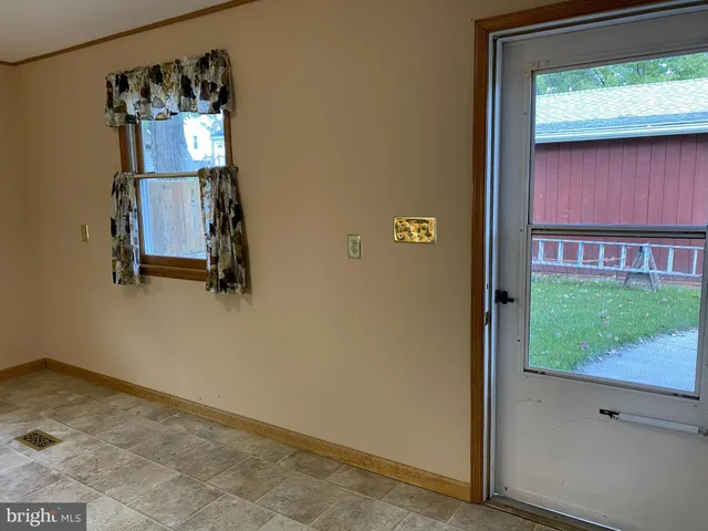a kitchen with a sink and a stove top oven