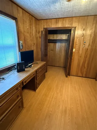 a room with a bed and furniture
