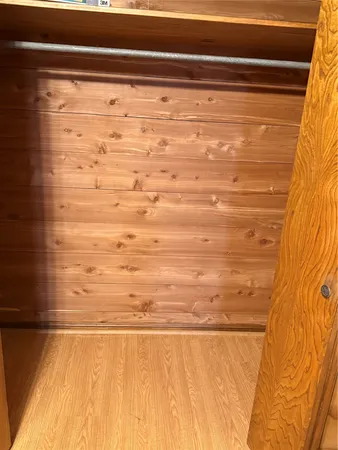 a room with a bed and a flat screen tv