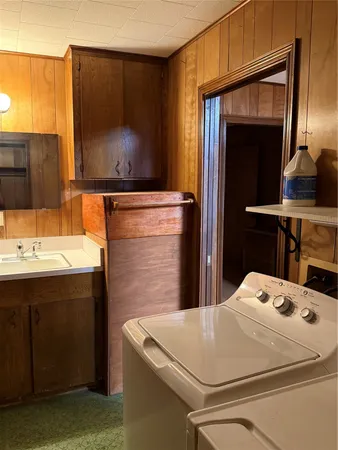 a room with pool table and windows