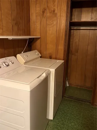 a room with pool table and windows
