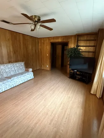 a view of an empty room with a fireplace