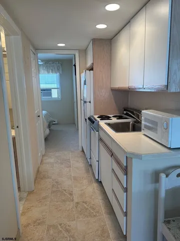 a kitchen that has a sink and a stove