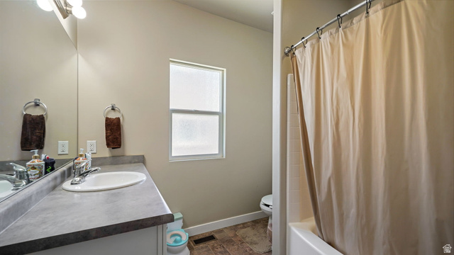 6062 Spring Street Stansbury Park, UT 84074 - Photo 14 of 36 Main Upstairs Bathroom featuring a white vanity with an integrated sink, a large wall-mounted mirror, and a frosted window