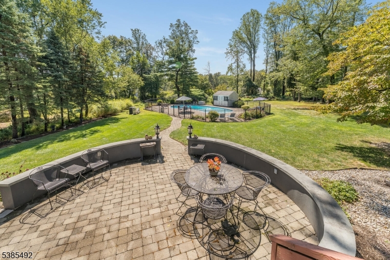 48 West Main Street Mendham, NJ 07945 - Photo 16 of 28 a view of a swimming pool and lounge chairs