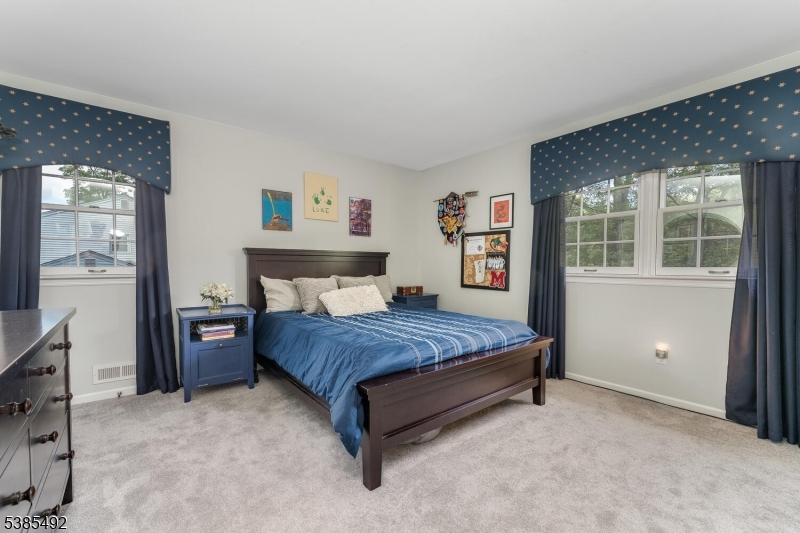 48 West Main Street Mendham, NJ 07945 - Photo 18 of 28 a bedroom with a bed and a closet