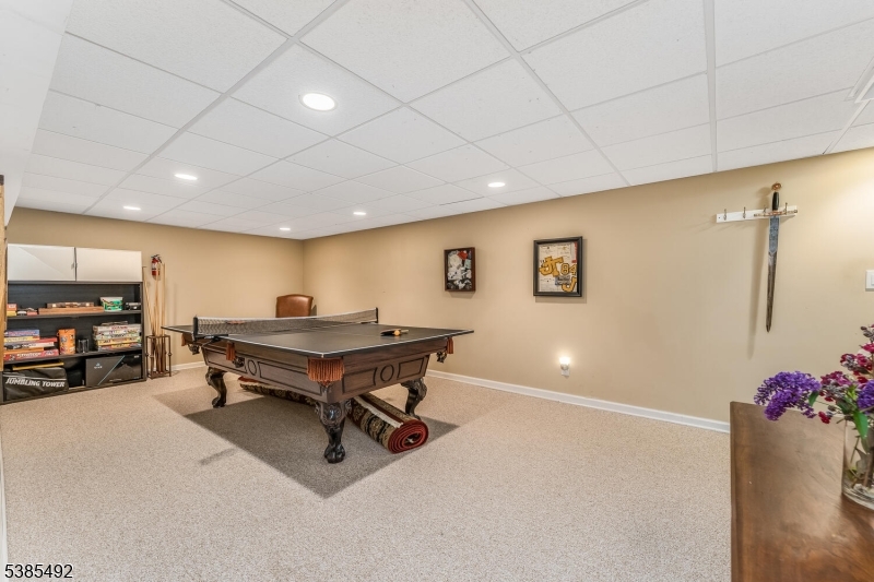 48 West Main Street Mendham, NJ 07945 - Photo 23 of 28 a room with furniture and a flat screen tv