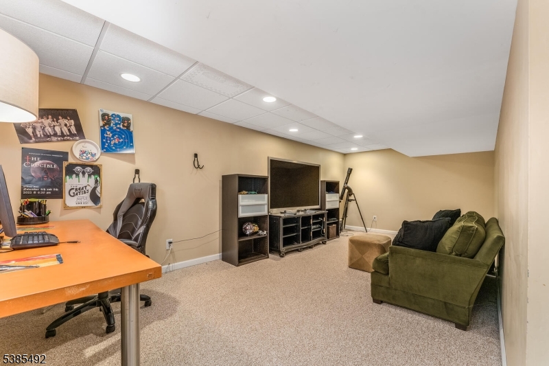 48 West Main Street Mendham, NJ 07945 - Photo 26 of 28 a living room with furniture and a flat screen tv